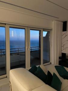 a bedroom with a bed and a view of the ocean at MH by MGM - Premium Sea Views in Porto
