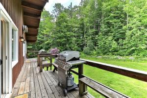 a grill on the porch of a house at Breakaway House by Killington Vacation Rentals in Killington