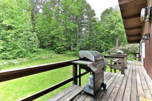 a washing machine sitting on a wooden deck at Breakaway House by Killington Vacation Rentals in Killington