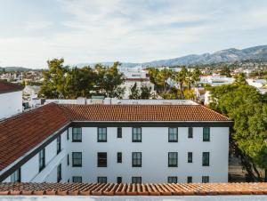 a view of a white building with red tile roofs at Hotel Santa Barbara in Santa Barbara