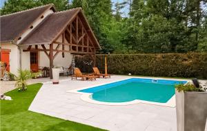 a swimming pool in a yard with a house at Pet Friendly Home In Salbris With Private Swimming Pool, Can Be Inside Or Outside in Salbris