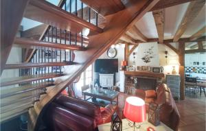 a living room with wooden ceilings and a staircase at Pet Friendly Home In Salbris With Private Swimming Pool, Can Be Inside Or Outside in Salbris