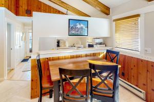 a kitchen with a wooden table and chairs at Big Sky Dreamin in Big Sky