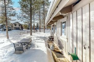 a porch of a house with snow on the ground at Big Sky Dreamin in Big Sky