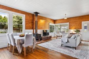 a dining room with a table and chairs at 'Balmoral Cottage' A Kingston Beach Escape in Kingston Beach