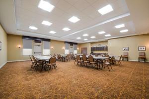 a large room with tables and chairs in it at Best Western Bandera Suites & Saloon in Bandera
