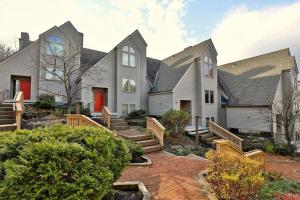 an exterior view of a house with a patio at Fall Line Condos by Killington VR - Studios in Killington +7 photos