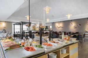 a buffet line with many different types of food at Best Western Hotel Vidöstern in Värnamo