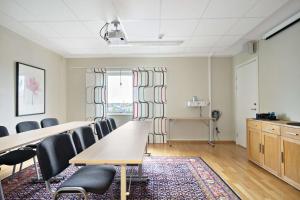 a conference room with tables and chairs and a window at Best Western Hotel Vidöstern in Värnamo