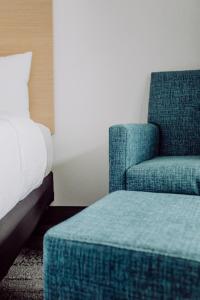 Postel nebo postele na pokoji v ubytování La Place Rendez-Vous Hotel