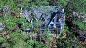 an aerial view of a house in the woods at Casa Vanilla Mang Den in Kon Von Kla