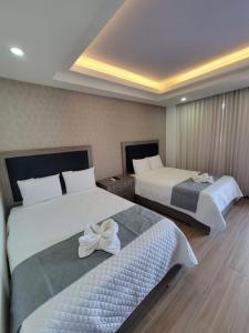 Postel nebo postele na pokoji v ubytování Hotel Cayuga