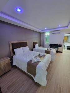 Postel nebo postele na pokoji v ubytování Hotel Cayuga