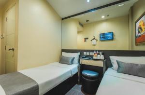 Ένα ή περισσότερα κρεβάτια σε δωμάτιο στο Value Hotel Nice