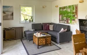 a living room with a couch and a coffee table at Cozy Home In Feldbach With Kitchen in Feldbach