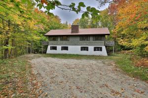 an old house in the middle of a dirt road at Left Duplex Home Directly Across From Pico Mountain, Close to Killington, home in Killington