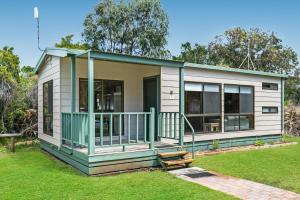 a small house with a green and white at BIG4 Breeze Holiday Parks - Port Elliot in Port Elliot
