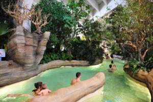 a group of people in a water slide at a theme park at Stylish modern apartment for 4 by Avoriaz Chalets in Avoriaz