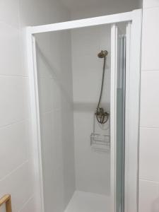 a shower with a glass door in a bathroom at Logroño Centro Home in Logroño