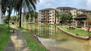 a river in front of some apartment buildings at Penthouse 4 Bedroom Seaview in Port Dickson