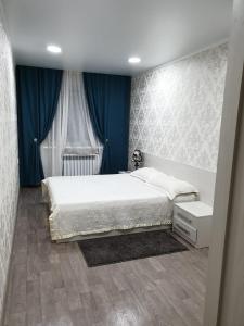 Postel nebo postele na pokoji v ubytování Apartment on Metallurgov 32