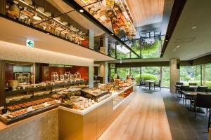 a restaurant with a buffet of food on display at Art Hotel Kokura New Tagawa in Kitakyushu