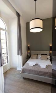 Posteľ alebo postele v izbe v ubytovaní N A P Experience Apartments