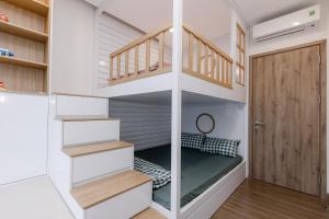 a small room with a bunk bed in a house at Ecopark - Lullaby Home Ecopark in HÆ°ng YÃªn