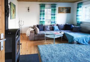 a living room with a couch and a table at Haus Matzenblick in Reith im Alpbachtal