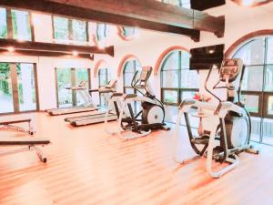 a gym with several treadmills and elliptical machines at Hua Hin La Casita Beautiful Two Bedroom Condo With Great Views in Hua Hin