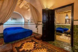 Ένα ή περισσότερα κρεβάτια σε δωμάτιο στο Hôtel Riad Dar Daïf