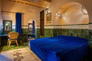 Ένα ή περισσότερα κρεβάτια σε δωμάτιο στο Hôtel Riad Dar Daïf