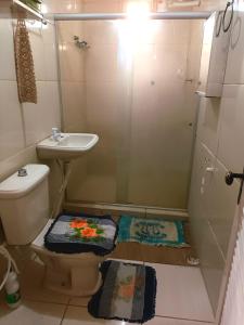 a bathroom with a shower and a toilet and a sink at Casa da Lu - PRAÇA DO CARMO OLINDA in Olinda