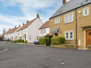 a row of houses on a street at Hollies Cottage 5 - Ukc4521 in Martock