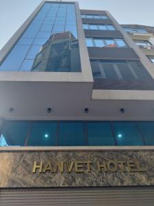 a hanover hotel sign in front of a building at Hanvet Hotel Ha Noi in Hanoi