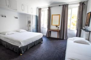 Postel nebo postele na pokoji v ubytování Hôtel Brasserie du Parc