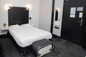 Postel nebo postele na pokoji v ubytování Hôtel Brasserie du Parc