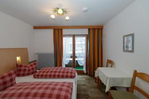 Postel nebo postele na pokoji v ubytování Hotel Binderhäusl + 15 fotografií