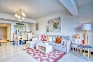 a living room with a couch and a table at LOFTS by Elegant Hospitality - across AUC in Cairo