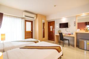 Postel nebo postele na pokoji v ubytování Tubtim Siam Suvarnabhumi Hotel