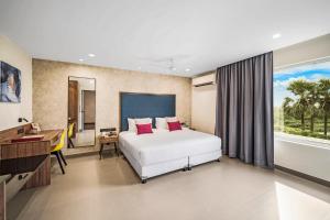 Postel nebo postele na pokoji v ubytování Regency Tuticorin by GRT Hotels