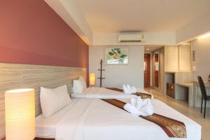 Postel nebo postele na pokoji v ubytování Tubtim Siam Suvarnabhumi Hotel