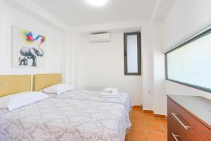 Posteľ alebo postele v izbe v ubytovaní Kalma Villa Pente