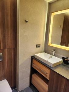 a bathroom with a sink and a mirror at Kopaonik Woodside in Kopaonik +17 photos