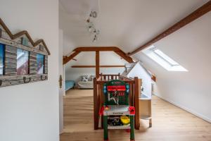 a attic room with a lego machine in the middle at Les Roches Plates in Fréhel