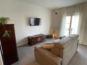 A television and/or entertainment centre at Lucia Holiday Apartments