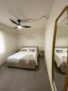 A bed or beds in a room at Lucia Holiday Apartments