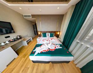 Postel nebo postele na pokoji v ubytování Costera Hotel