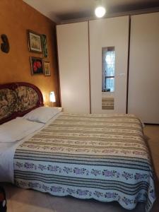a bedroom with a large bed in a room at Porta di Roma locazione turistica in Rome
