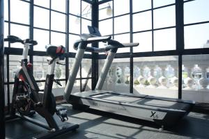 a gym with a treadmill and some bottles of water at Maya Manor Boutique Hotel by KGH Group in Kathmandu